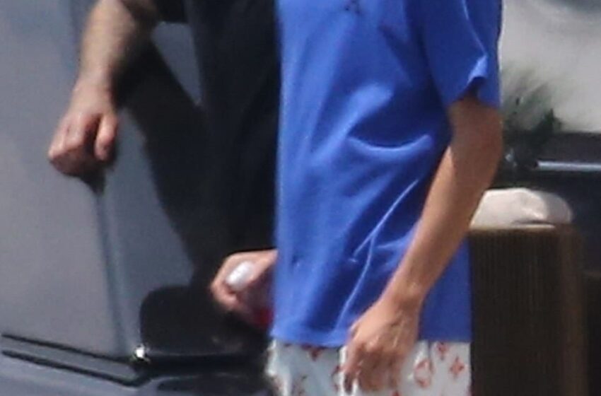  David Beckham wraps his arm around son Romeo, 19, as they relax on £5million yacht in Miami