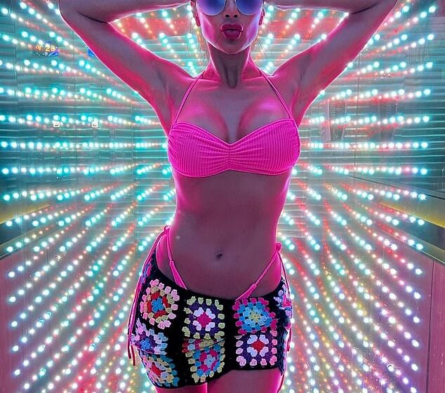  Nicole Scherzinger, 43, puts on a busty display in a hot pink bikini