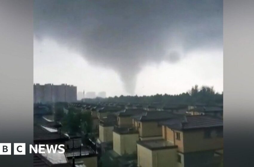  Debris flies through air as tornado hits China city